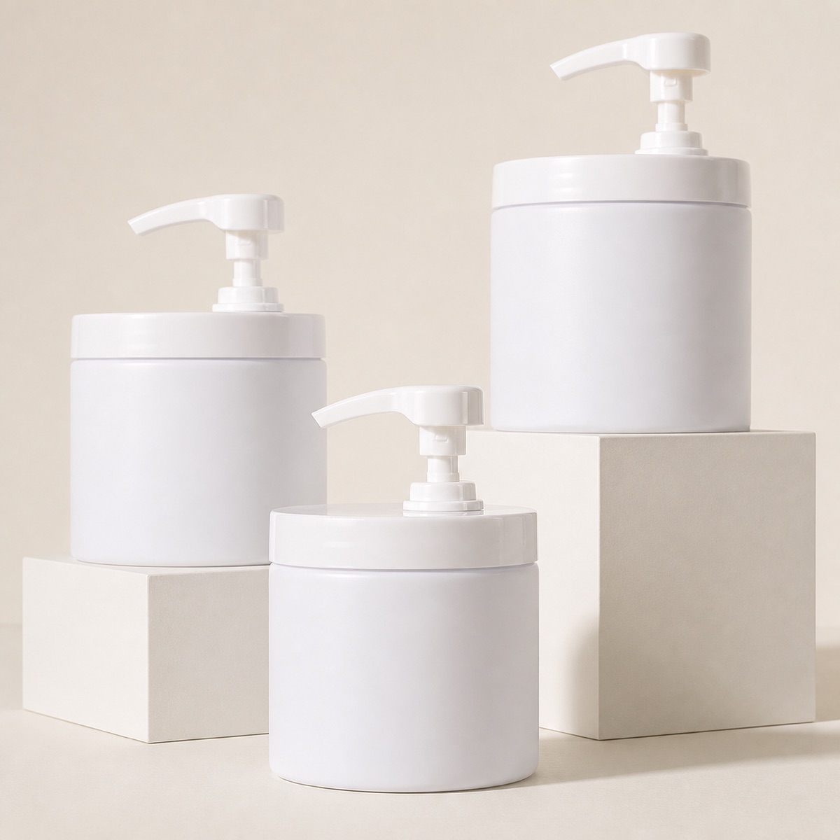 three-white-wide-mouth-pet-lotion-pump-jars-on-display-blocks
