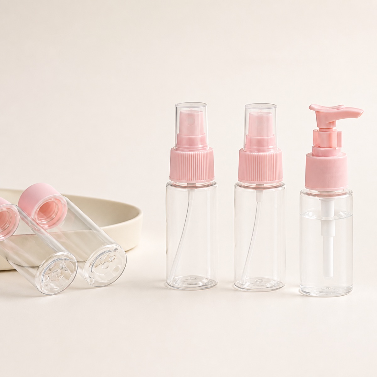 clear-pet-travel-bottles-with-pink-pump-and-spray-closures