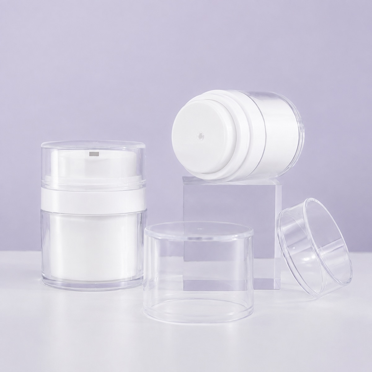 white-airless-cream-jar-pump-mechanism-and-clear-outer-container