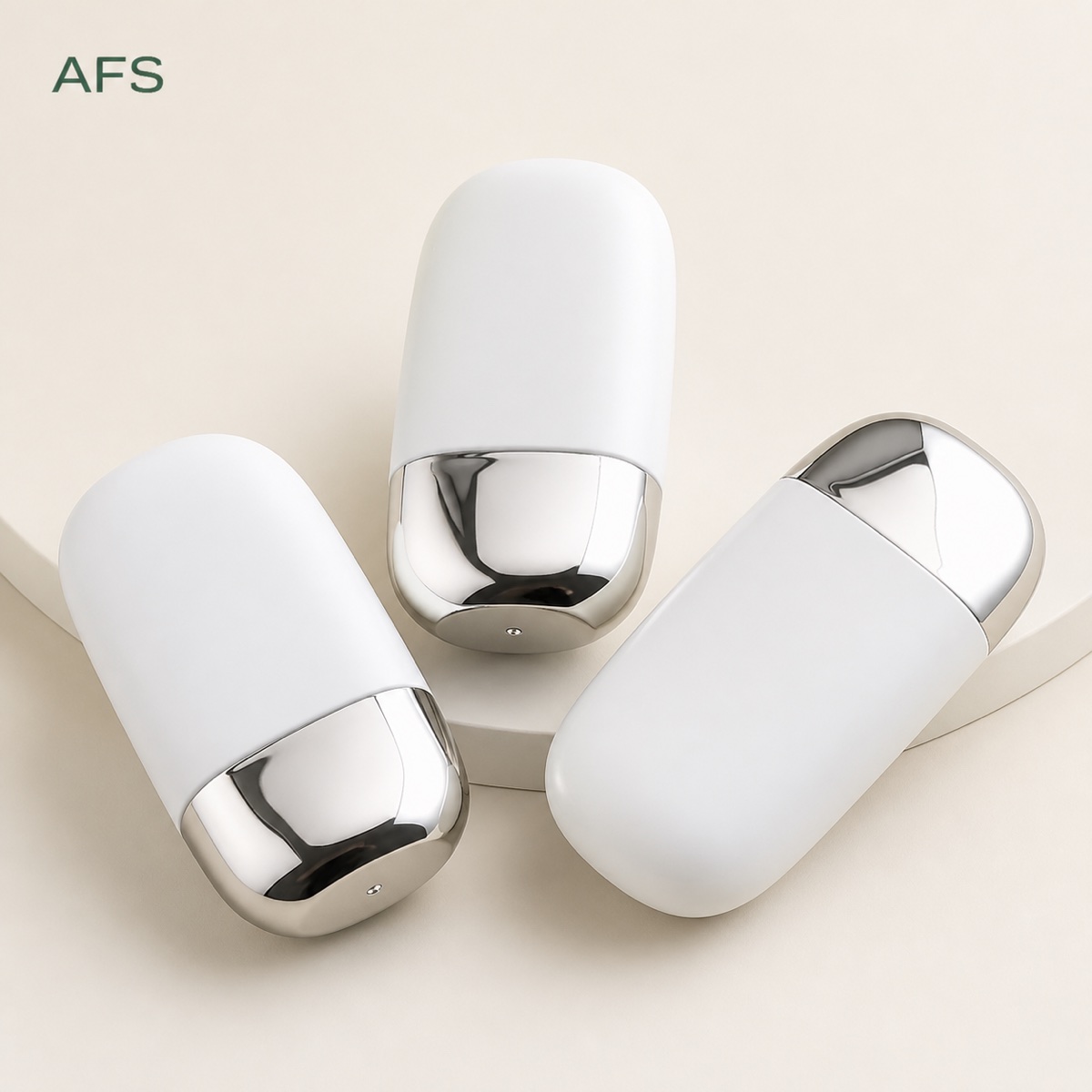 three-white-oval-cosmetic-squeeze-bottles-with-silver-base-accents
