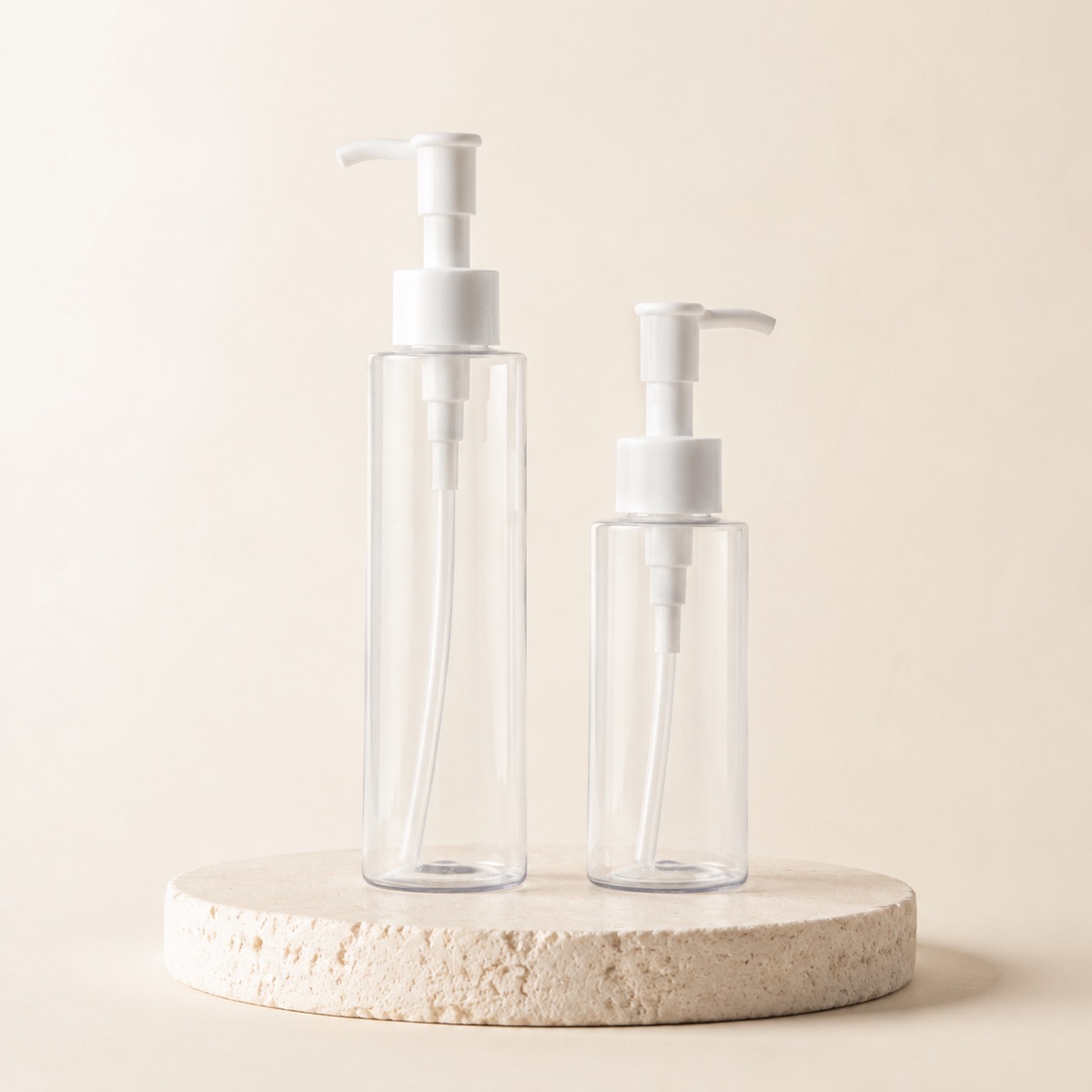 two-clear-pet-flat-shoulder-lotion-pump-bottles-on-display