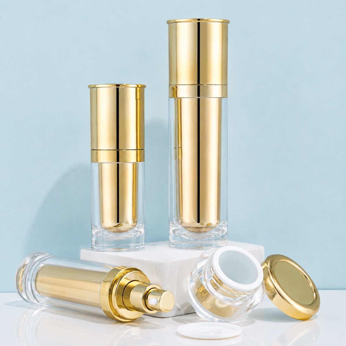 gold-airless-skincare-bottles-and-jars-with-open-components