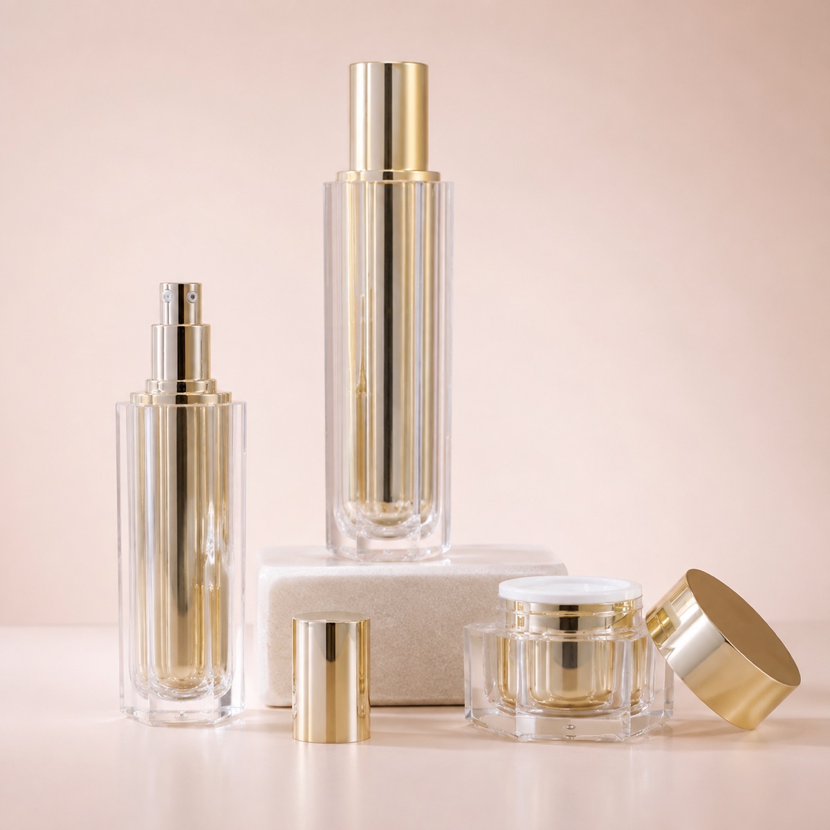 luxury-hexagonal-acrylic-pump-bottles-and-cream-jars-with-gold-finish
