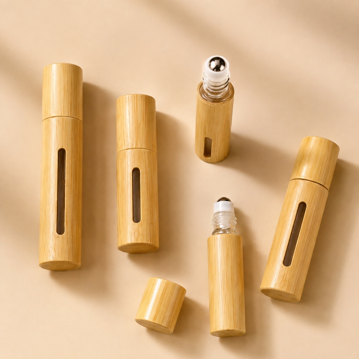3ml-5ml-10ml-bamboo-essential-oil-roll-on-and-spray-bottle-five-bamboo-bottles-arranged-in-a-flat-lay