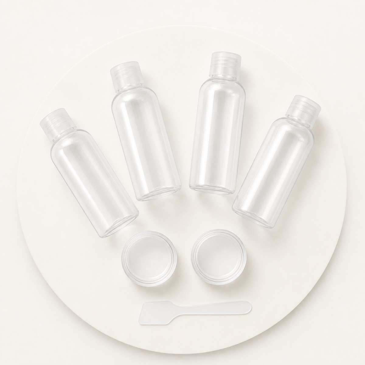 90ml-silicone-travel-toiletry-bottle-set-with-clear-accessory-containers-in-a-flat-lay
